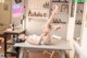 A woman laying on top of a table in a room.